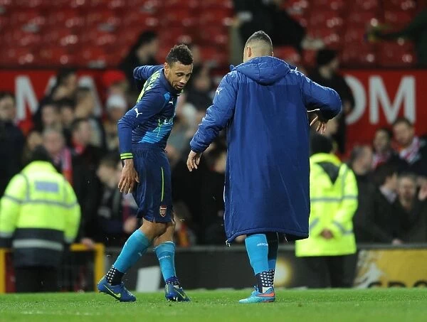Celebrating Victory: Coquelin and Oxlade-Chamberlain's Unforgettable Moment after Arsenal's FA Cup Win vs Manchester United (2015)