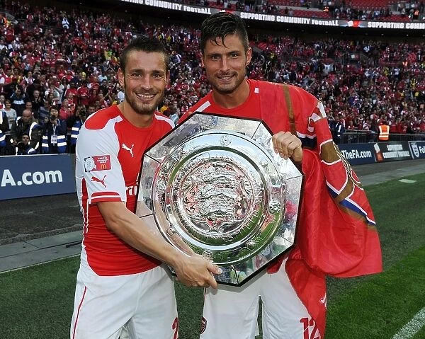 Celebrating Victory: Debuchy and Giroud of Arsenal after FA Community Shield Win against Manchester City