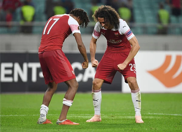 Celebrating Victory: Iwobi and Guendouzi Rejoice After Arsenal's UEFA Europa League Win Against Qarabag