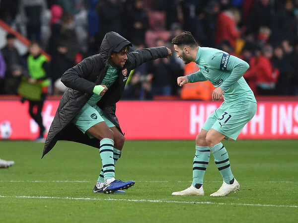 Celebrating Victory: Iwobi and Kolasinac of Arsenal