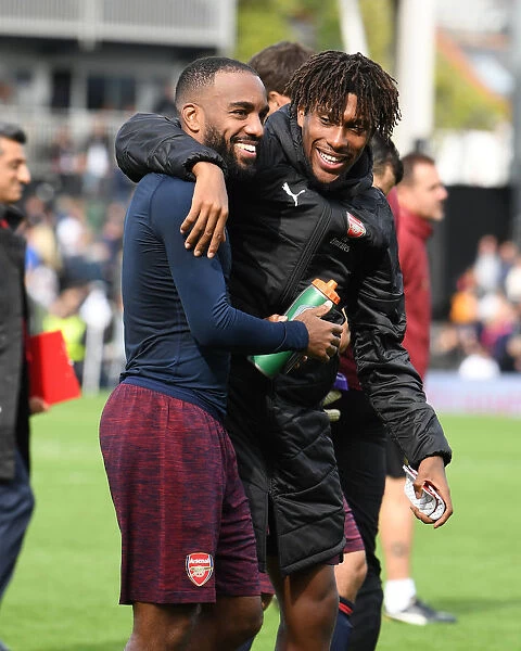 Celebrating Victory: Lacazette and Iwobi Rejoice After Arsenal's Win Against Fulham