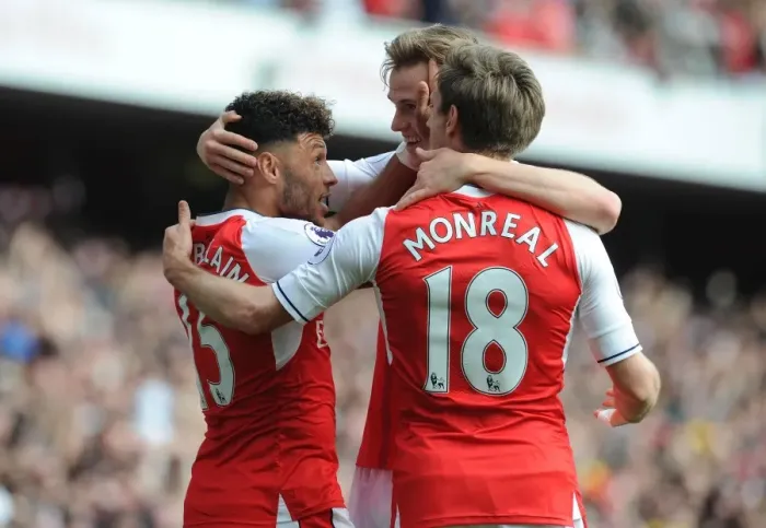Framed Print : Celebrating Victory: Oxlade-Chamberlain, Holding, and Monreal Rejoice After Arsenal's Goals vs Manchester United (2016-17)