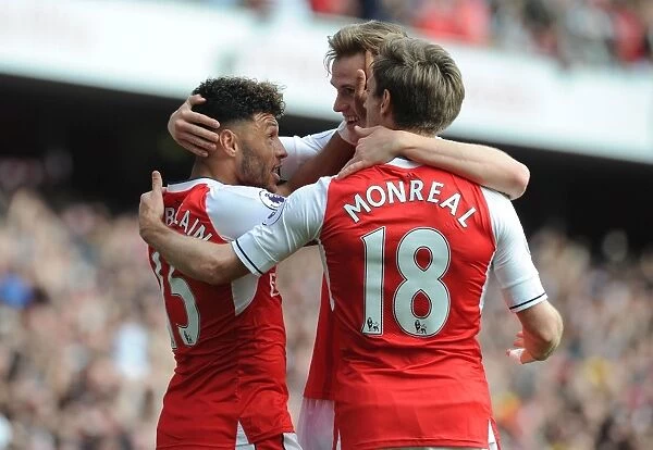 Celebrating Victory: Oxlade-Chamberlain, Holding, and Monreal Rejoice After Arsenal's Goals vs Manchester United (2016-17)