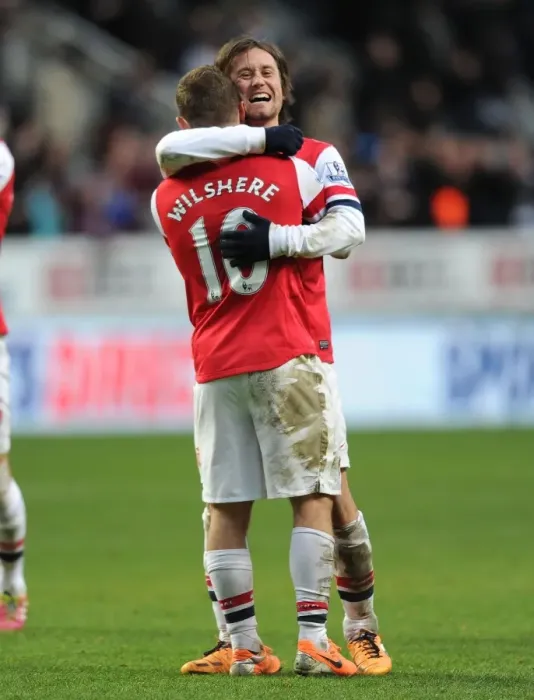 Framed Print : Celebrating Victory: Rosicky and Wilshere Rejoice after Arsenal's Win against Newcastle United (2013-14)