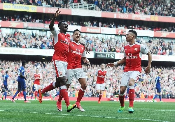 Celebrating Victory: Welbeck, Sanchez, and Gibbs of Arsenal