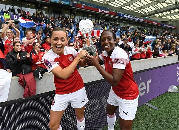 Celebration: McCabe and Carter's Winning Moment for Arsenal Women vs. Brighton & Hove Albion