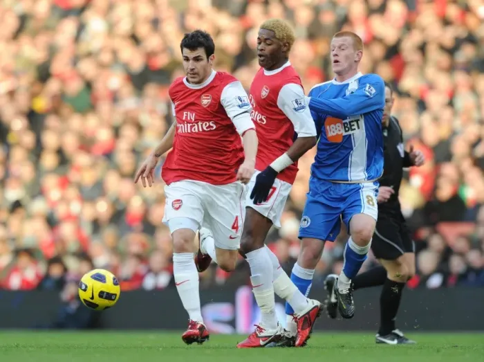 Framed Print : Cesc Fabregas and Alex Song (Arsenal) Ben Watson (Wigan) with mascots and officials before the match. Arsenal 3: 0 Wigan Athletic. Barclays Premier League, Emirates Stadium, Arsenal Football Club, London, 22  /  1  /  2011. Credit : Stuart MacFarlane  /  Arsenal