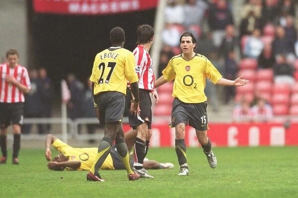 Cesc Fabregas (Arsenal) confronts Dan Smith (Sunderland) after his foul on Abu Diaby