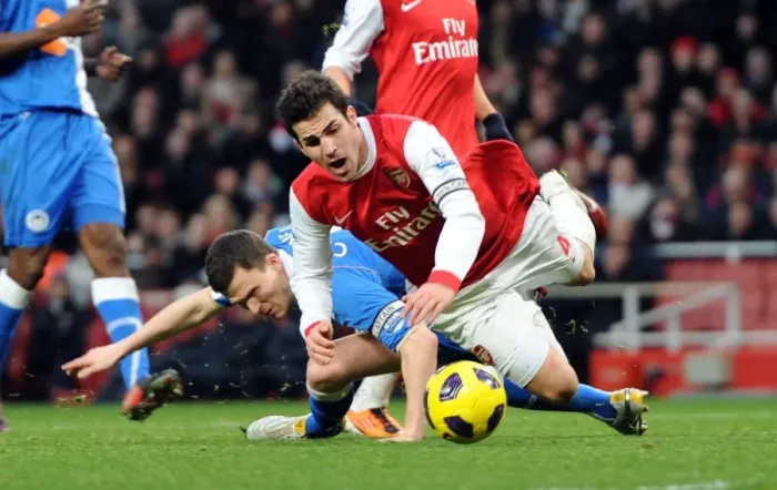 Framed Print : Cesc Fabregas (Arsenal) is fouled by Gary Caldwell (Wigan) for the Arsenal penalty