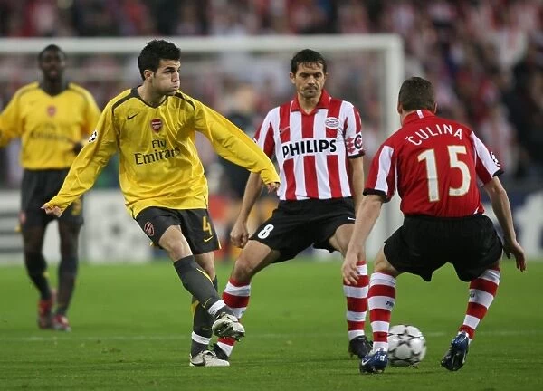 Cesc Fabregas (Arsenal) Jasco Culina and Phillip Cocu (PSV)