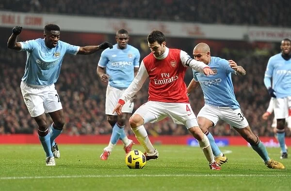 Cesc Fabregas (Arsenal) Kolo Toure and Nigel De Jong (Man City). Arsenal 0