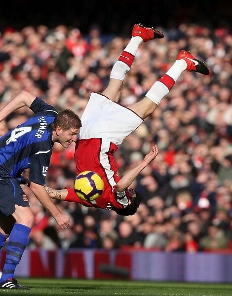 Cesc Fabregas (Arsenal) Michael Turner (Sunderland). Arsenal 2:0 Sunderland