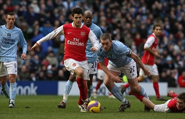 Cesc Fabregas (Arsenal) Richard Dunn (Manchester City)