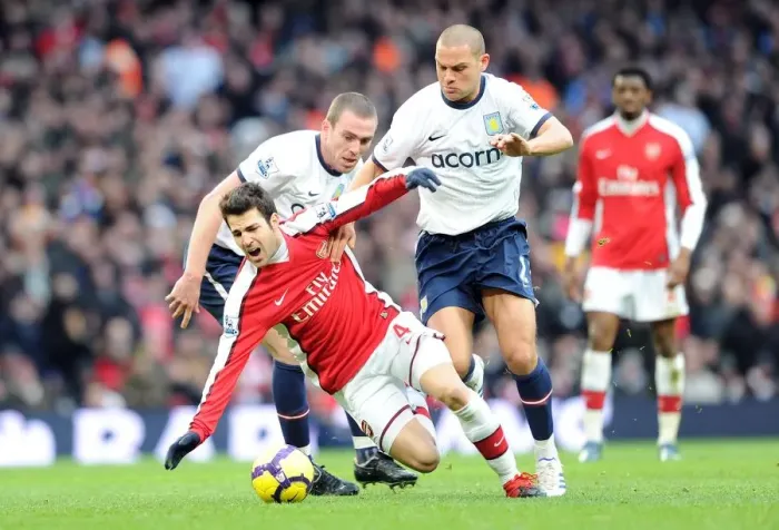 Framed Print : Cesc Fabregas (Arsenal) Richard Dunne and Luke Young (Aston Villa). Arsenal 3