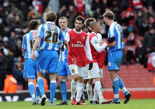 Cesc Fabregas (Arsenal) shakes hands with Kevin Kilbane (Huddersfield) after the match