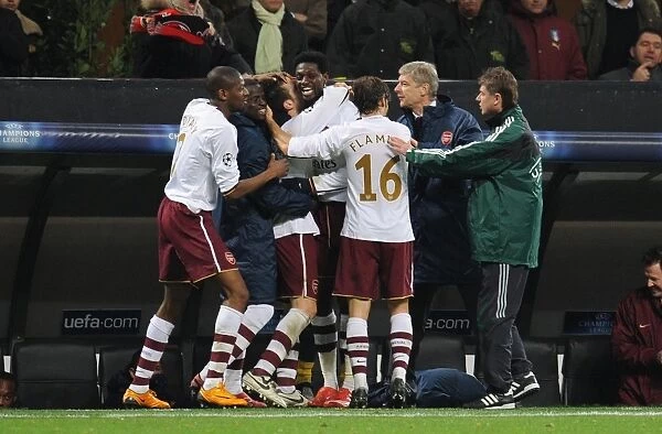 Cesc Fabregas celebrates scoring the 1st Arsenal goal with Emmanuel Eboue