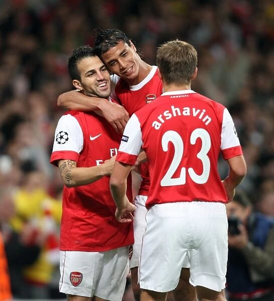 Cesc Fabregas celebrates scoring Arsenal and his 1st goal with Marouane Chamakh