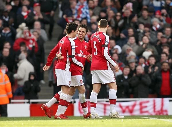 Cesc Fabregas celebrates scoring Arsenals 1st goal with Samir Nasri