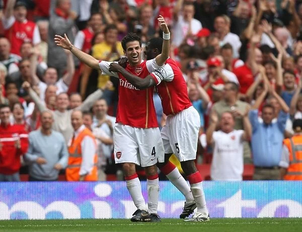 Cesc Fabregas celebrates scoring Arsenals 4th goal with Kolo Toure