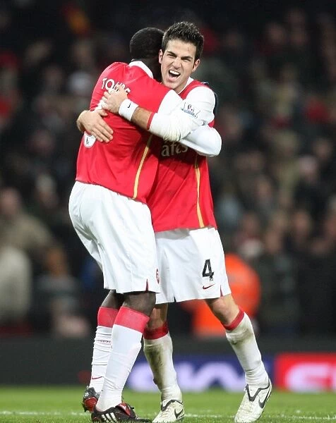 Cesc Fabregas and Kolo Toure (Arsenal) celebrate at the final whistle