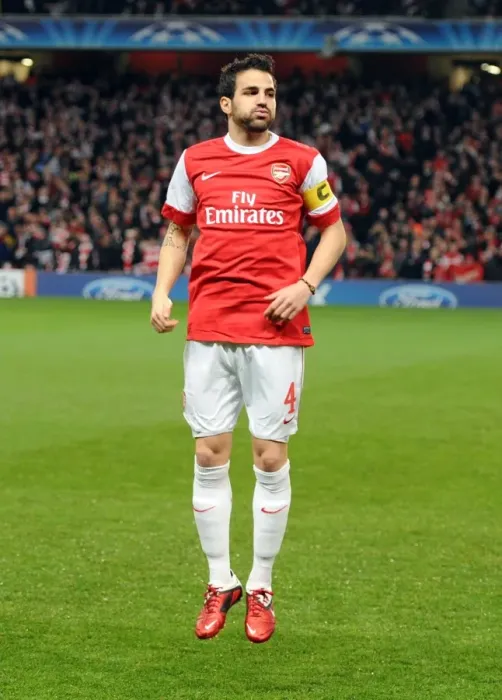 Framed Print : Cesc Fabregas Leads Arsenal to Glory: 2-1 Victory over Barcelona in the Champions League at Emirates Stadium