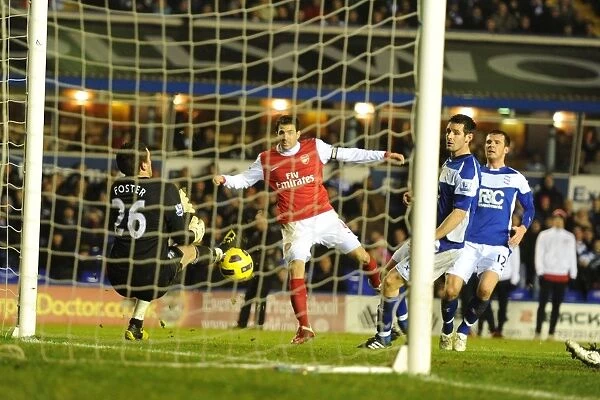 Cesc Fabregas looks on as his shot is put inot his own net by Birmingham defender Roger Johnson