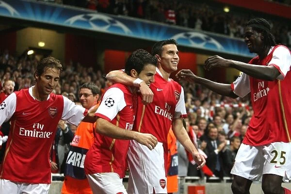 Cesc Fabregas, Robin van Persie celebrate the 1st Arsenal goal