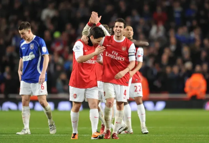 Framed Print : Cesc Fabregas and Samir Nasri (Arsenal) celebrate at the end of the match