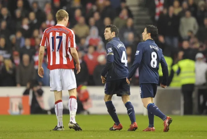 Framed Print : Cesc Fabregas and Samir Nasri (Arsenal) clash with Ryan Shawcross (Stoke) Framed Print : Cesc Fabregas and Samir Nasri (Arsenal) clash with Ryan Shawcross (Stoke)