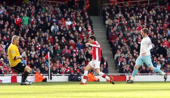 Framed Print : Cesc Fabregas scores Arsenals 1st goal past Brian Jensen (Burnley)