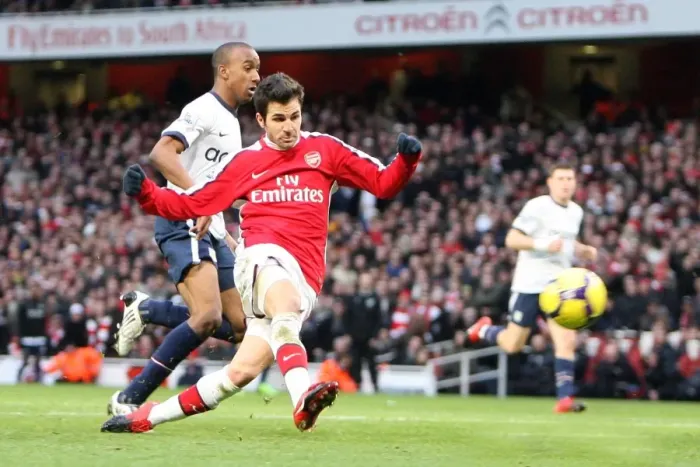 Framed Print : Cesc Fabregas scores his and Arsenals 2nd goal under pressure from Fabian Delph