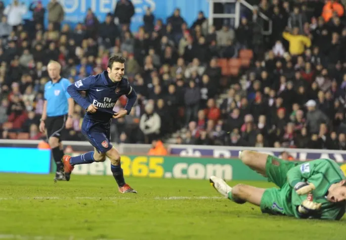 Framed Print : Cesc Fabregas Scores Stunner Past Stoke's Sorensen: Arsenal Cruises to 3-1 Victory Framed Print : Cesc Fabregas Scores Stunner Past Stoke's Sorensen: Arsenal Cruises to 3-1 Victory