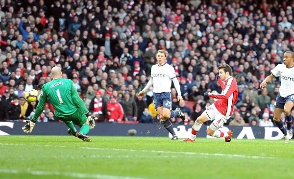 Cesc Fabregas shoots past Aston Villa goalkeeper Brad Friedel to score the 2nd Arsenal goal
