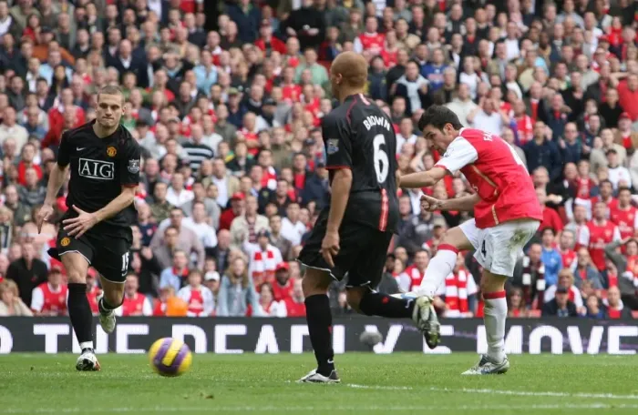 Framed Print : Cesc Fabregas shoots past Edwin van der Sar to score the 1st Arsenal goal Framed Print : Cesc Fabregas shoots past Edwin van der Sar to score the 1st Arsenal goal