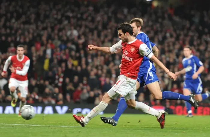 Framed Print : Cesc Fabregas shoots past Ipswich goalkeeper Marton Fulop to score the 3rd Arsenal goal