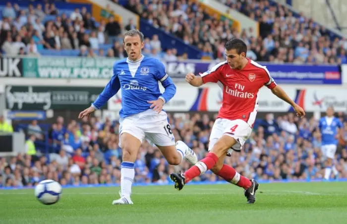 Framed Print : Cesc Fabregas shoots past Phil Neville to score the 4th Arsenal goal