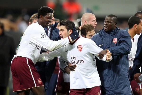 Cesc Fabregas and Teammates Celebrate First Goal: Arsenal's 2-0 Victory Over AC Milan in the UEFA Champions League