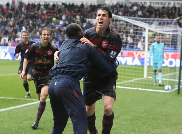 Framed Print : Cesc Fabregas Triumphant Goal: Arsenal's 3-2 Victory Over Bolton Wanderers (Fabregas, Eboue, Flamini)