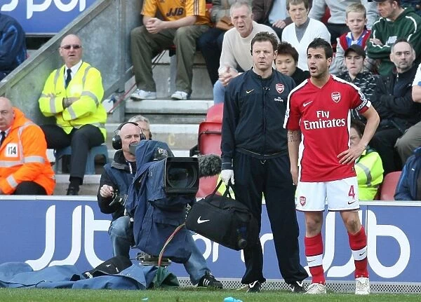 Cesc Fabregas Victory Moment with Physio Colin Lewin after Arsenal's 1:4 Win over Wigan Athletic