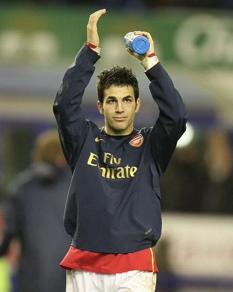 Cesc Fabregas waves to the Arsenal fans after the match