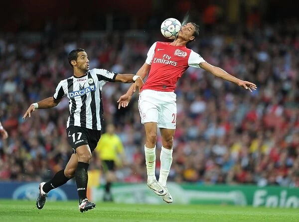Chamakh vs Benatia: A Battle of Strengths in Arsenal's UEFA Champions League Clash (August 2011)