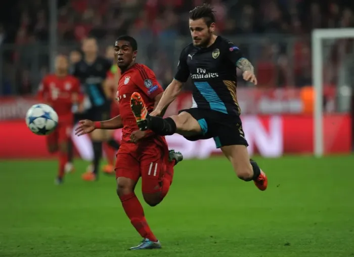 Framed Print : Champions Clash: Debuchy vs. Costa - Battle at the Allianz Arena (Bayern Munich vs. Arsenal, UEFA Champions League, 2015-16) Framed Print : Champions Clash: Debuchy vs. Costa - Battle at the Allianz Arena (Bayern Munich vs. Arsenal, UEFA Champions League, 2015-16)
