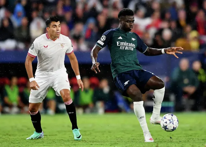 Framed Print : Champions League Battle: Bukayo Saka vs. Marcos Acuna - Wings Collide in Sevilla vs. Arsenal (2023-24)