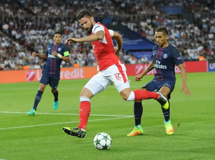 Framed Print : Champions League Showdown: Olivier Giroud vs Marquinhos - A Clash of Titans: Paris Saint-Germain vs Arsenal (2016-17)