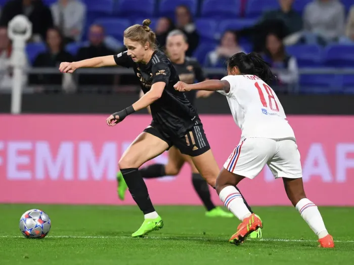 Framed Print : Champions League Showdown: Olympique Lyonnais vs. Arsenal Women - Miedema Takes On Sombath