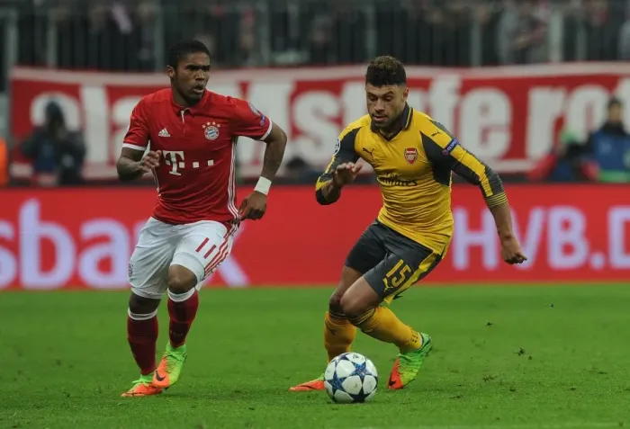Framed Print : Champions League Showdown: Oxlade-Chamberlain vs. Costa Clash - Bayern Munich vs. Arsenal: A Battle of Wings Framed Print : Champions League Showdown: Oxlade-Chamberlain vs. Costa Clash - Bayern Munich vs. Arsenal: A Battle of Wings