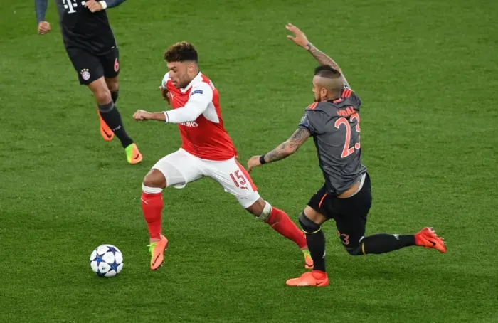 Framed Print : Champions League Showdown: Oxlade-Chamberlain vs. Vidal at Emirates Stadium