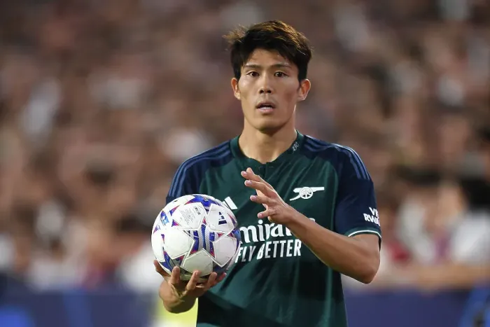 Framed Print : Champions League Showdown: Tomiyasu's Focus - Sevilla vs. Arsenal (2023-24): Arsenal's Japanese Defender Steals the Spotlight at Estadio Ramon Sanchez Pizjuan