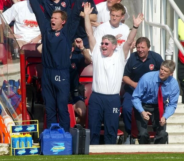 Champions Triumph: Arsenal's Arsene Wenger, Pat Rice, and Gary Lewin Celebrate 2:1 Victory over Leicester City (FA Premiership, 2004)