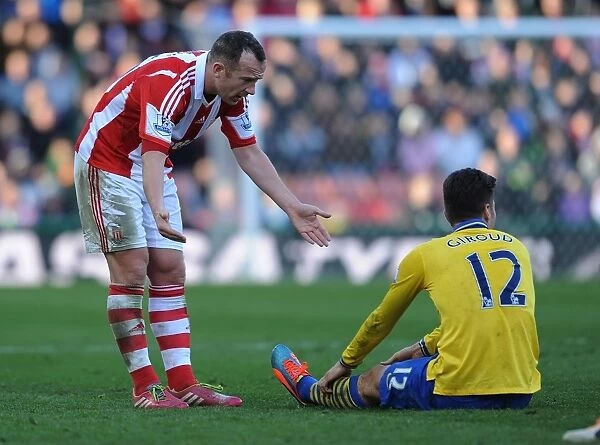 Charlie Adam and Olivier Giroud: A Moment of Dialogue During Stoke City vs. Arsenal (2013-14)